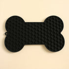 Alfombra para lamer CloudSleep — alfombra de silicona negra en forma de hueso, con textura de panal y aro para colgar.