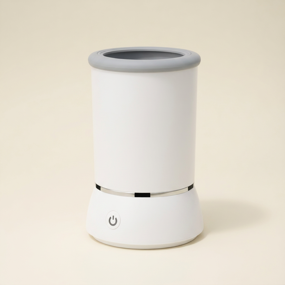White paw cleaner cup with grey opening, silver band and front power button.