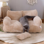 Grey cat climbing onto a mousse coffee CloudSleep plush sofa bed