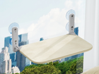 CloudSleep window hammock for cats with beige breathable mesh cover, mounted on a window with suction cups