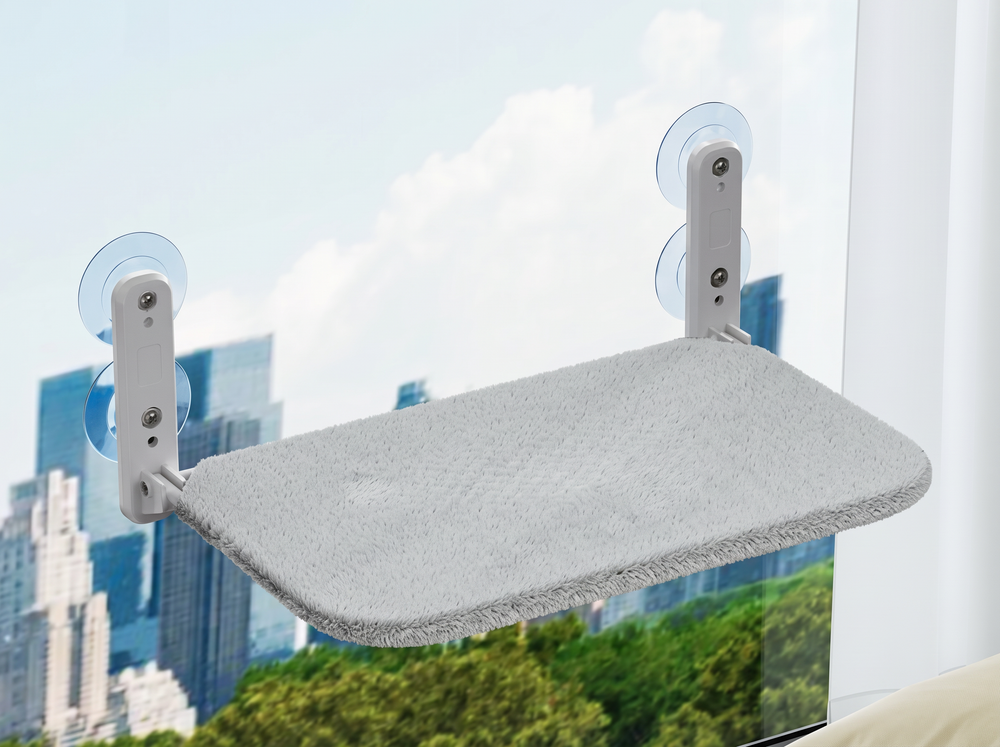 CloudSleep window hammock for cats with gray plush cover, mounted on a window with suction cups