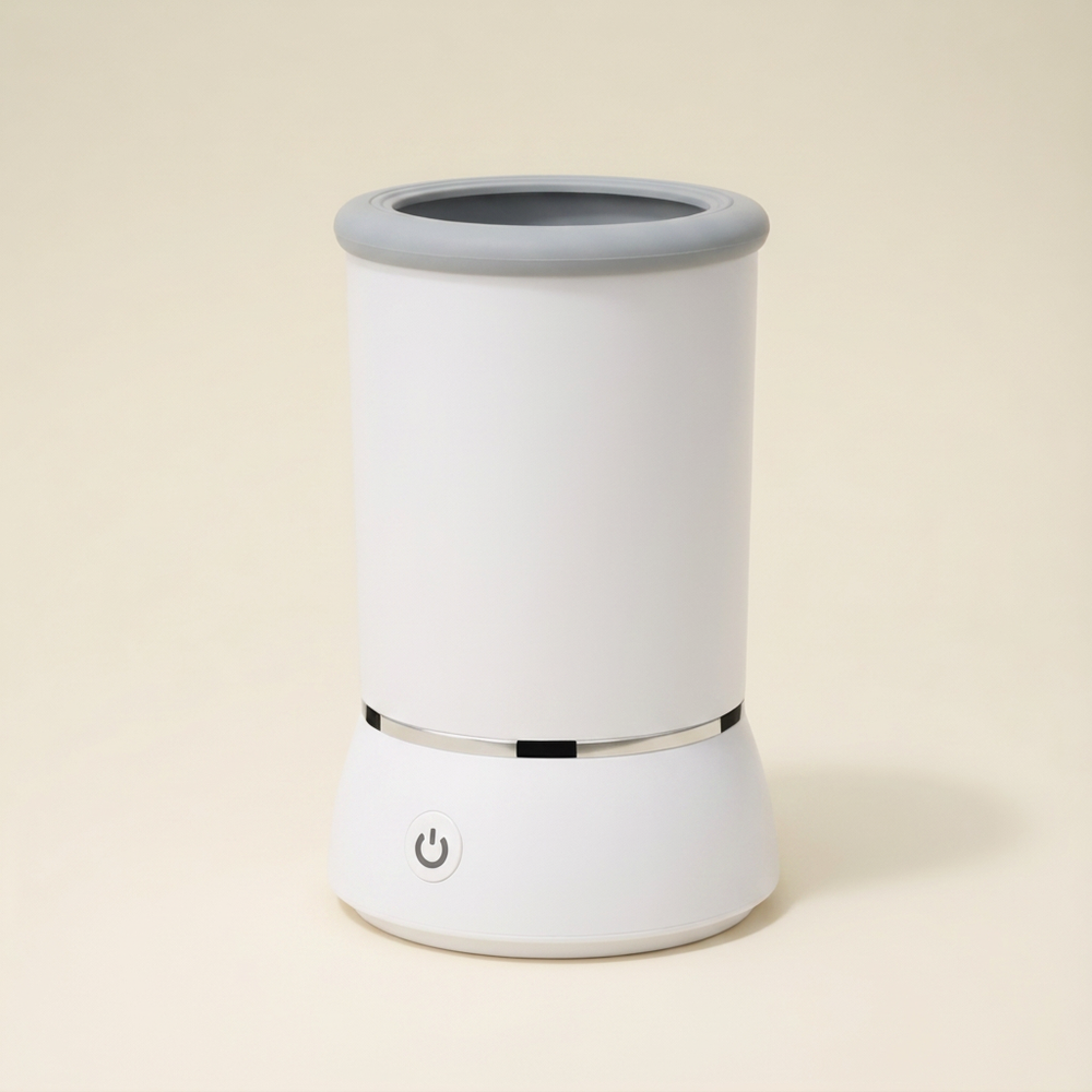 White paw cleaner cup with a grey opening, silver band and front power button.